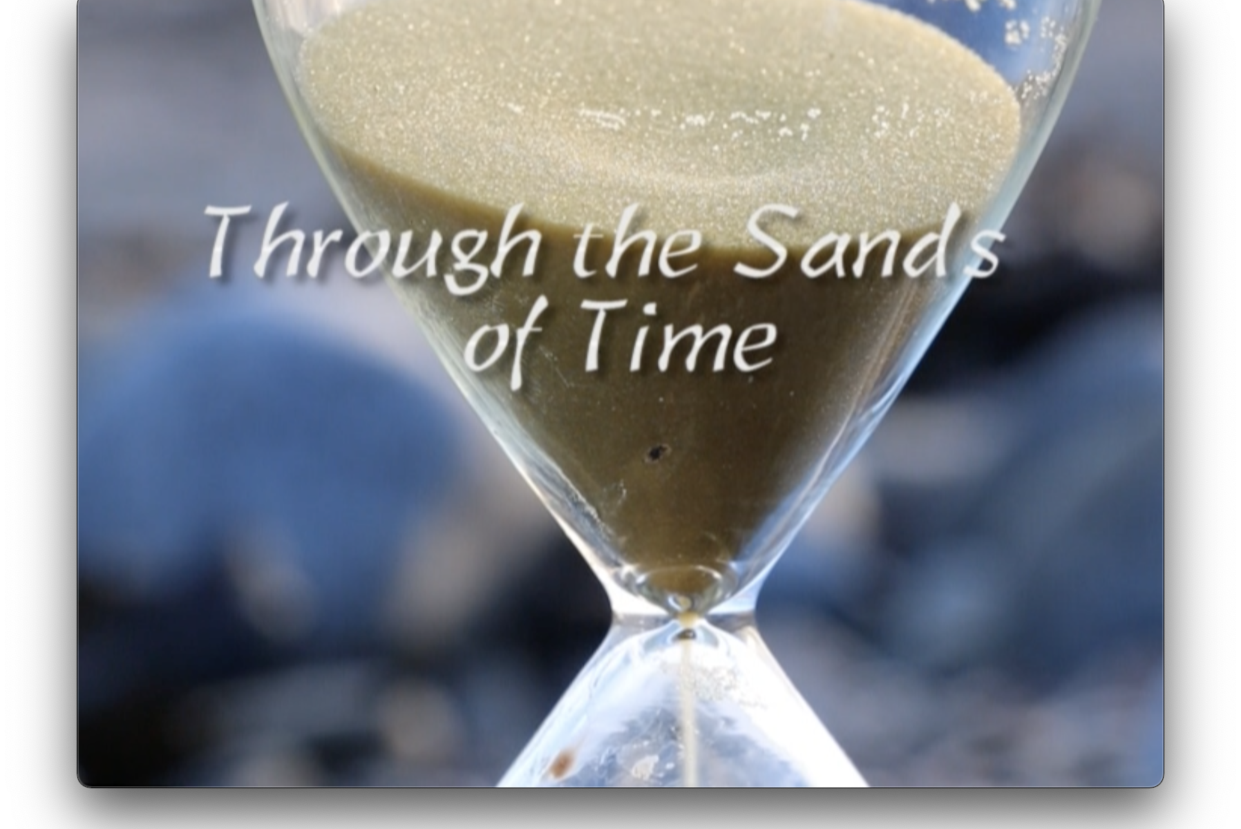 Sand falling through an hourglass